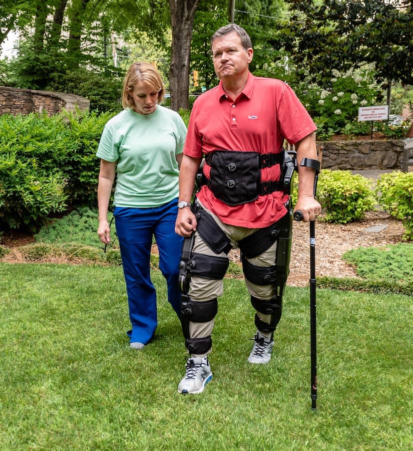 man-walking-grass-indego-exoskelton