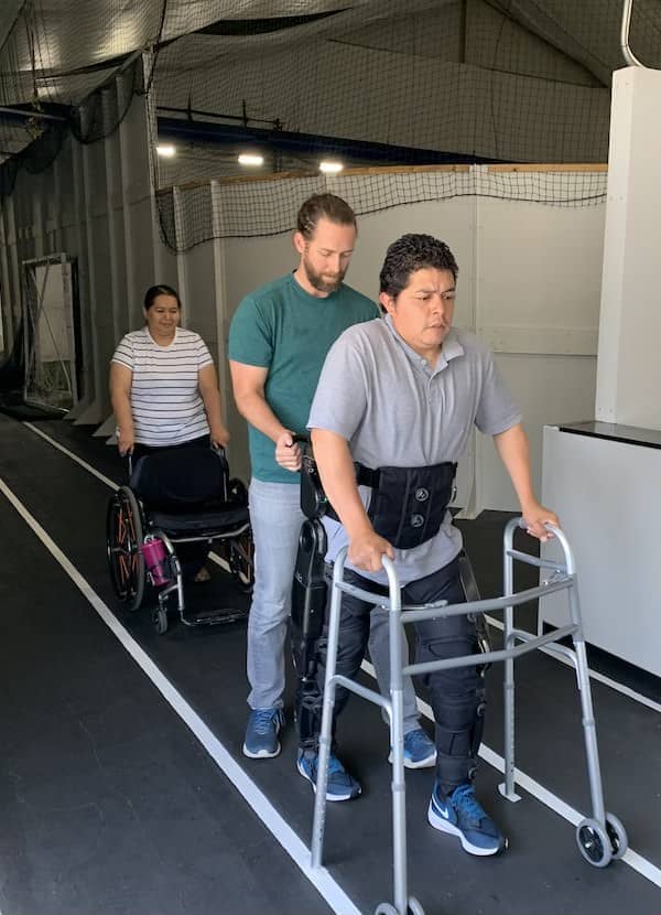 Client-Erik-walking-with-Exoskeleton